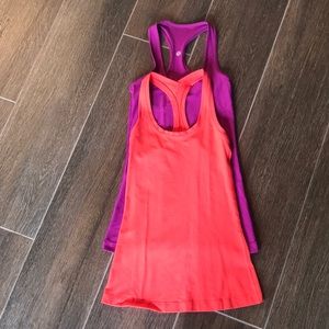 Purple & Orange Lululemon Tanks sold together in very good condition.